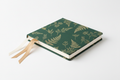 Botanica Luxe Event Planner – studio shot showing the agenda closed with both silk ribbon bookmarks visible and the gold foil botanical cover art fully displayed